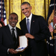 Andre Dubois, grandnephew of former U.S. Rep. Shirley Chisholm (D-N.Y.), receives the Presidential Medal of Freedom on behalf of the late congresswoman from President Barack Obama during an East Room ceremony at the White House in Washington, D.C., on Nov. 24, 2015.
Alex Wong/Getty Images
